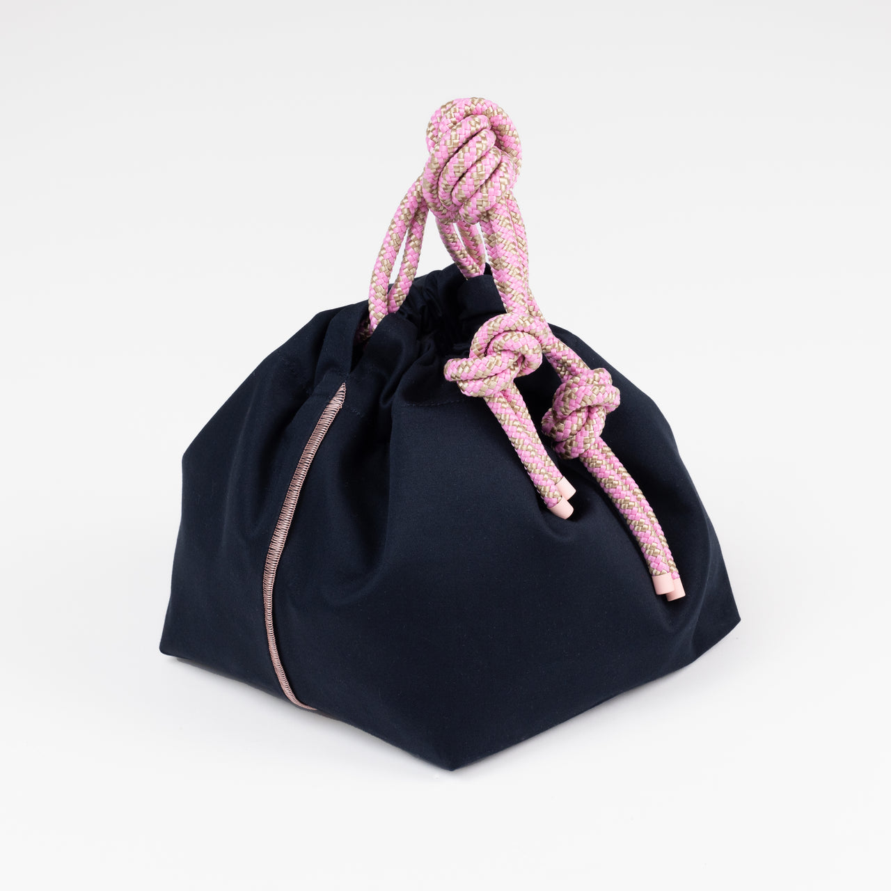 Black drawstring bag with pink rope handles